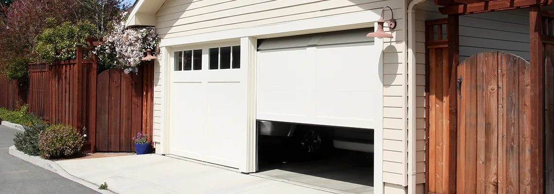 Fix Metal Garage Door Jerking in Alton, Illinois